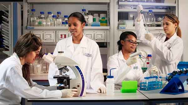 Young scientific women who work on vaccine candidates