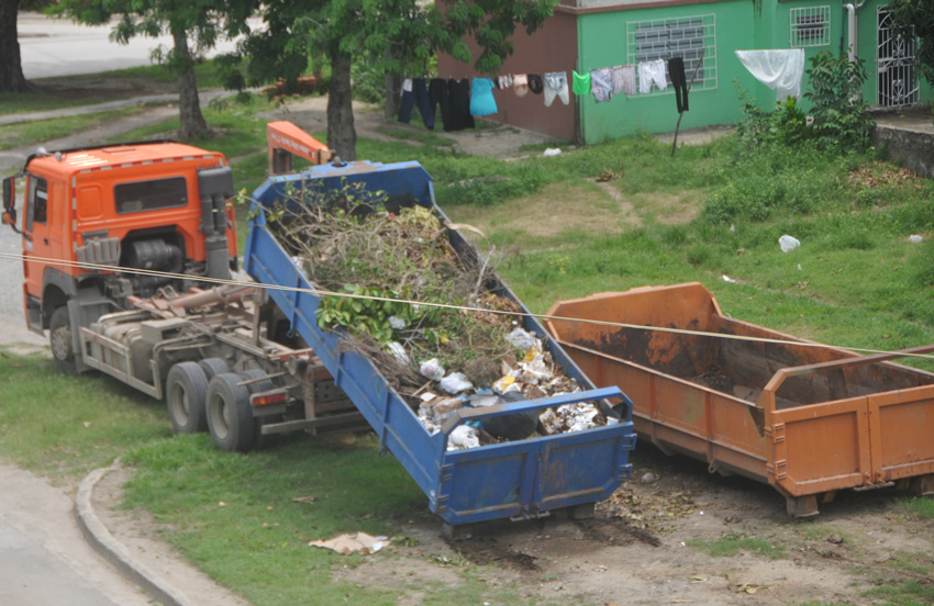 There are only to waste-collector trucks