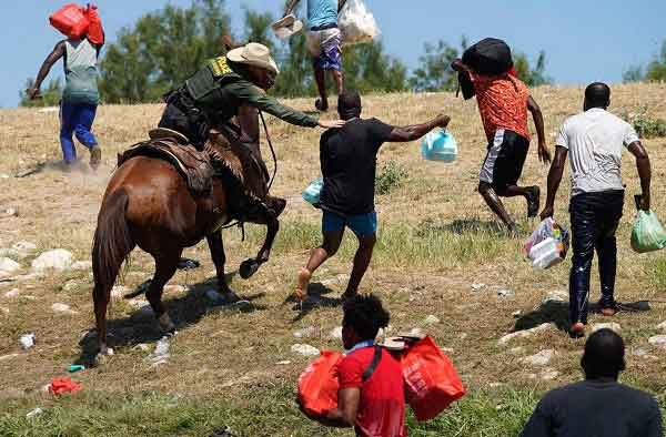Shocking photos and video footage of U.S. Border Patrol agents on horseback chasing, grabbing and whipping Haitian asylum seekers