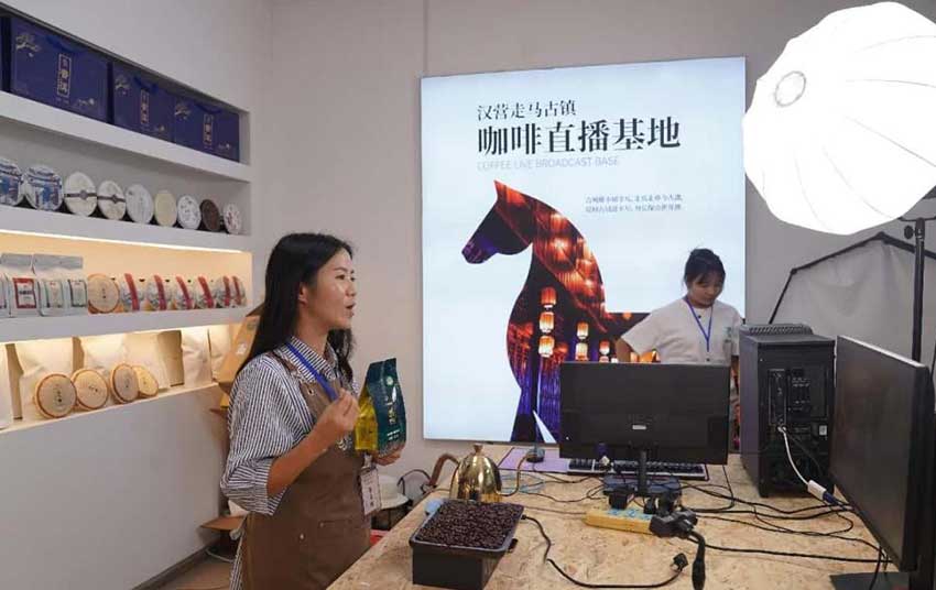 A woman sells coffee beans via livestream in Longyang district, Baoshan, southwest China's Yunnan province.