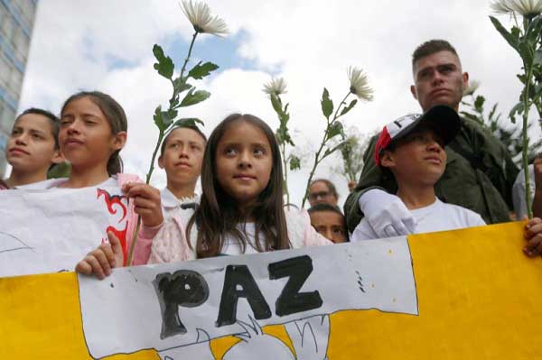 People take part in a rally against violence, following a car bomb explosion, in Bogotá, Colombia. 