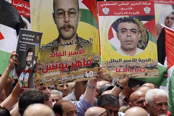 Demonstrators are seen marking the Palestinian Prisoners' Day in Ramallah, the occupied West Bank.