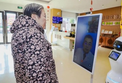 A senior consults a doctor via a telemedicine system at an elderly care home in Shanghai. 
