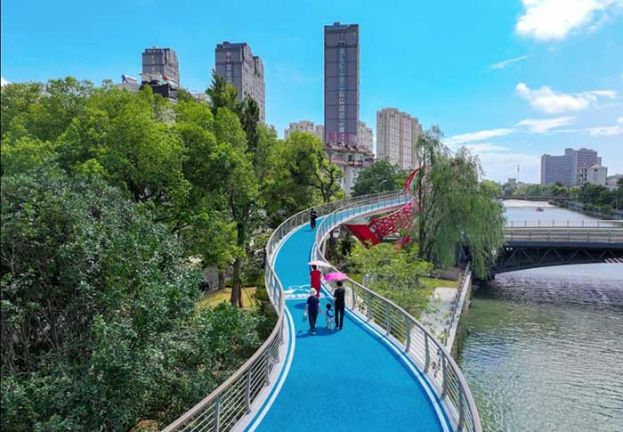 Citizens walk on a fitness trail in Changxing county, Huzhou, east China's Zhejiang province. 