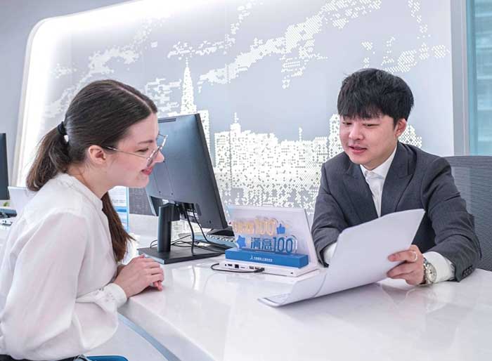Anna, a Russian professional, applies for a work permit at the Bund Service Center for International Professionals in Shanghai.