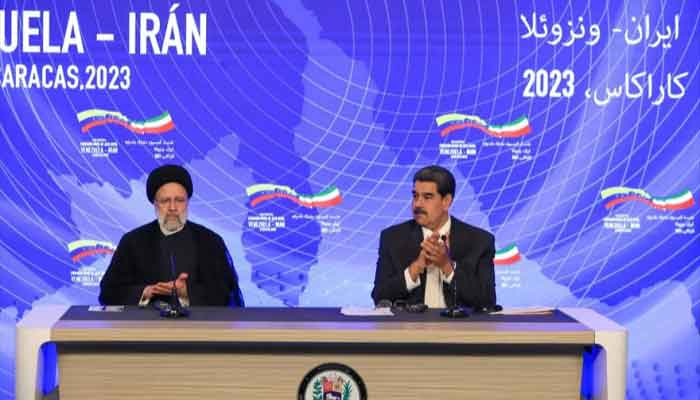 Iranian President Ebrahim Raeisi (L) and his Venezuelan counterpart Nicolas Maduro in Caracas, Venezuela, on June 12, 2023