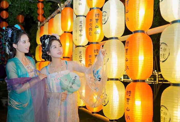 Tourists visit a lantern fair in a wetland park in Changxing county, Huzhou, August 2, 2024.