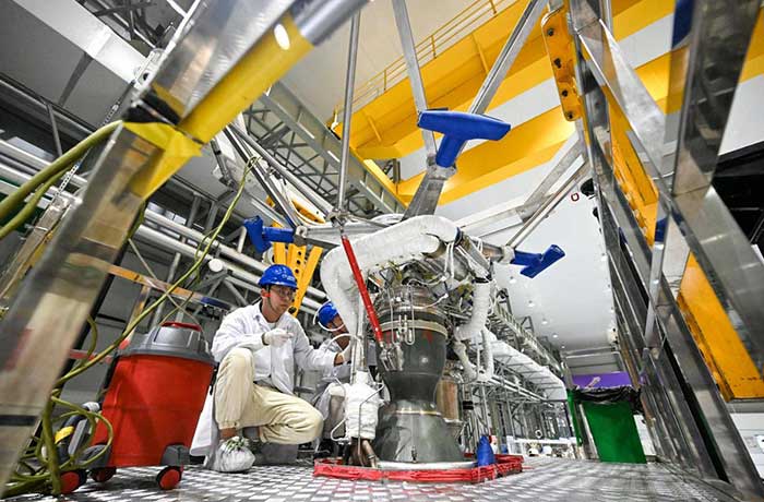 Technicians assemble a liquid oxygen-methane rocket engine at the general assembly plant of Chinese commercial rocket firm LandSpace in Huzhou, east China's Zhejiang province.