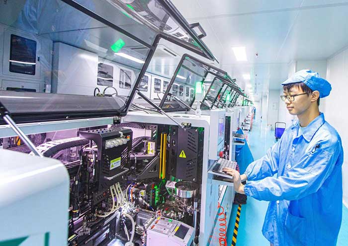 An employee of a tech firm in Huangshi, central China's Hubei province, manufactures light-emitting diode (LED) displays.